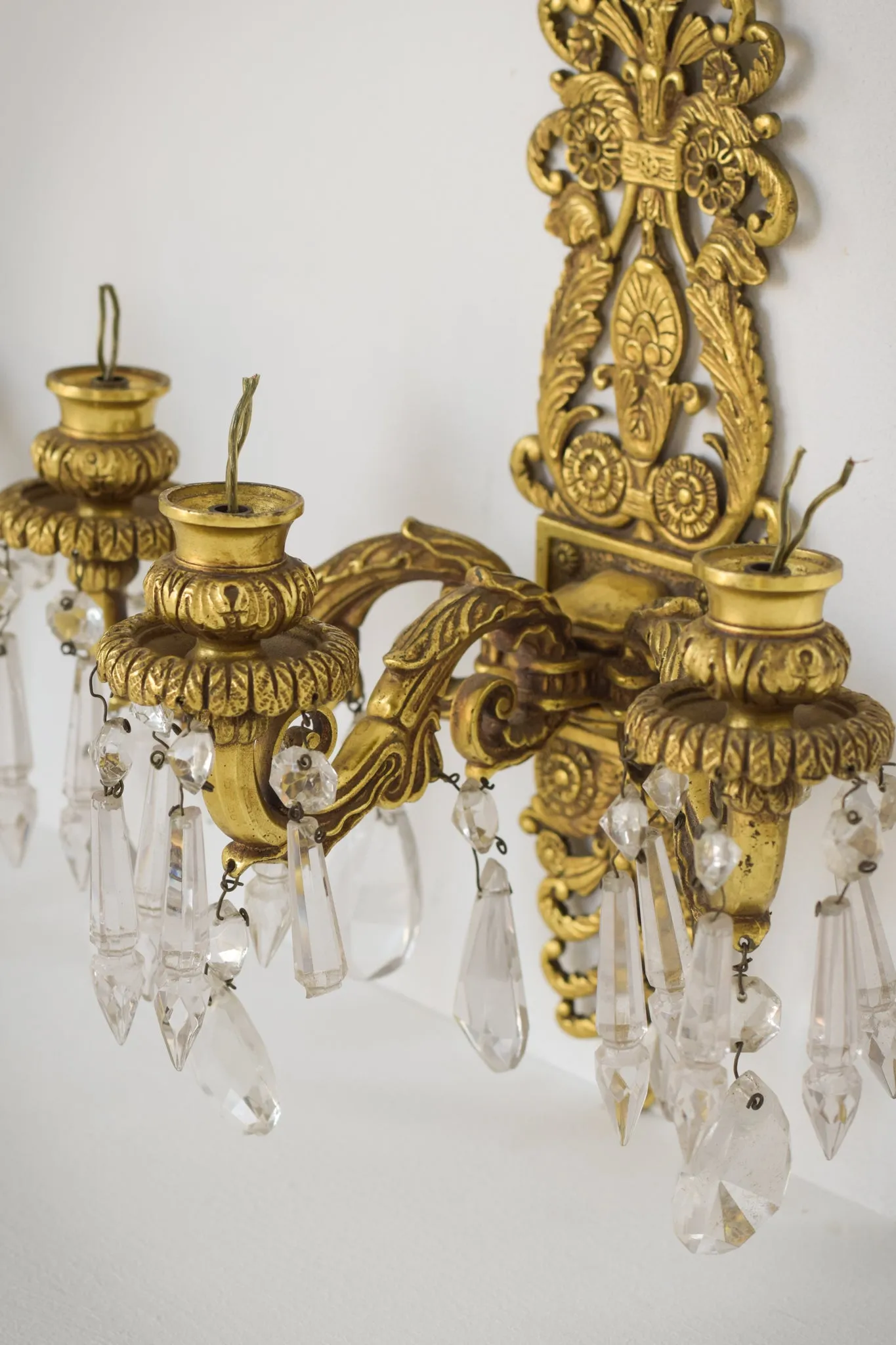 Two - Bronze and Cut Glass Wall-Mounted Chandeliers