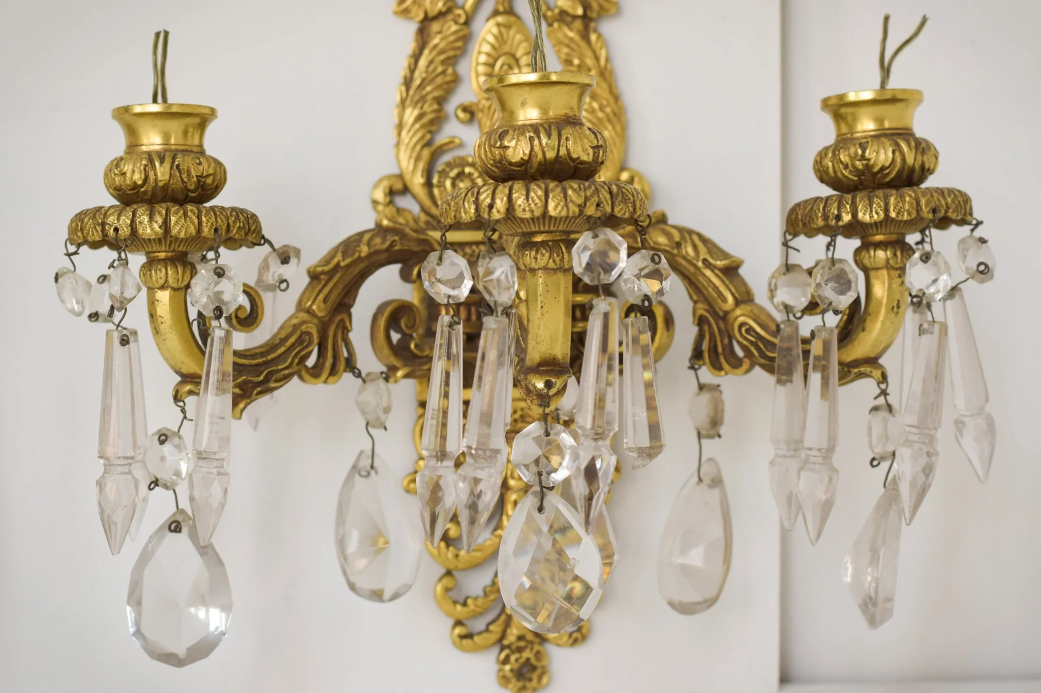 Two - Bronze and Cut Glass Wall-Mounted Chandeliers